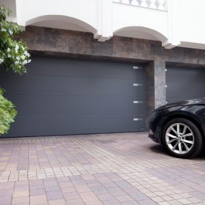 parking space with a car in front of a garage